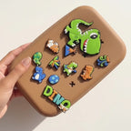 Brown pouch with colorful dinosaur designs on a light background
