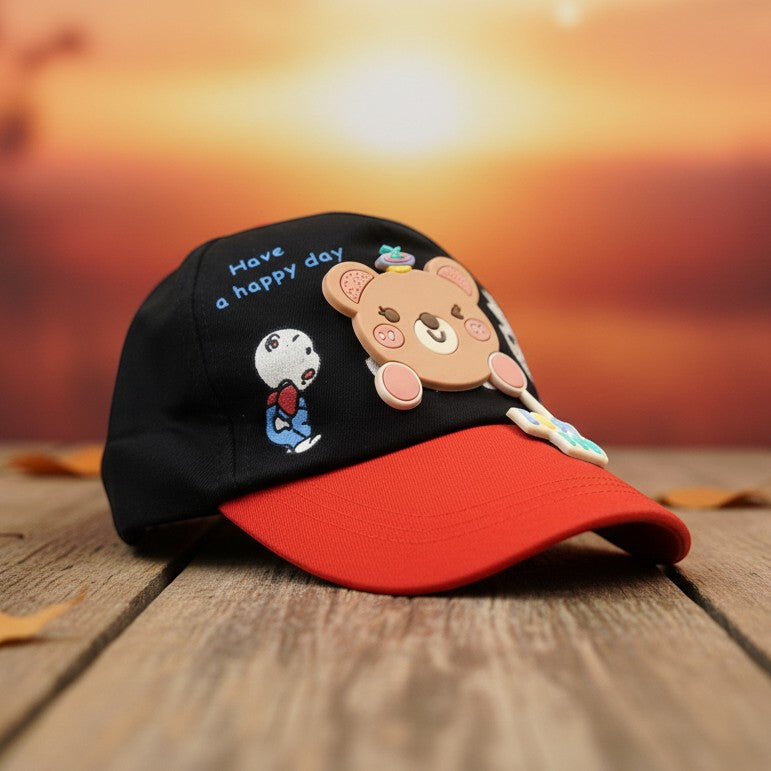 Mango Muffins black cotton cap with red brim, featuring a 3D bear charm and "Have a happy day" text.