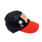 Mango Muffins black cotton cap with red brim, featuring a 3D bear charm and "Have a happy day" embroidery.