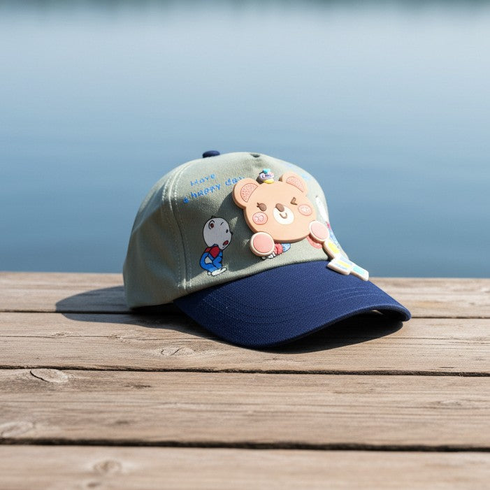 Mango Muffins light green cotton cap with navy brim and a 3D bear charm with 'Love You' text.