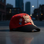 Mango Muffins red cotton cap with black brim, featuring a 3D bear charm and "Have a happy day" embroidery.