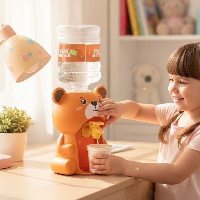 Mango Muffins orange bear water dispenser with mini cups, used by a child on a desk.