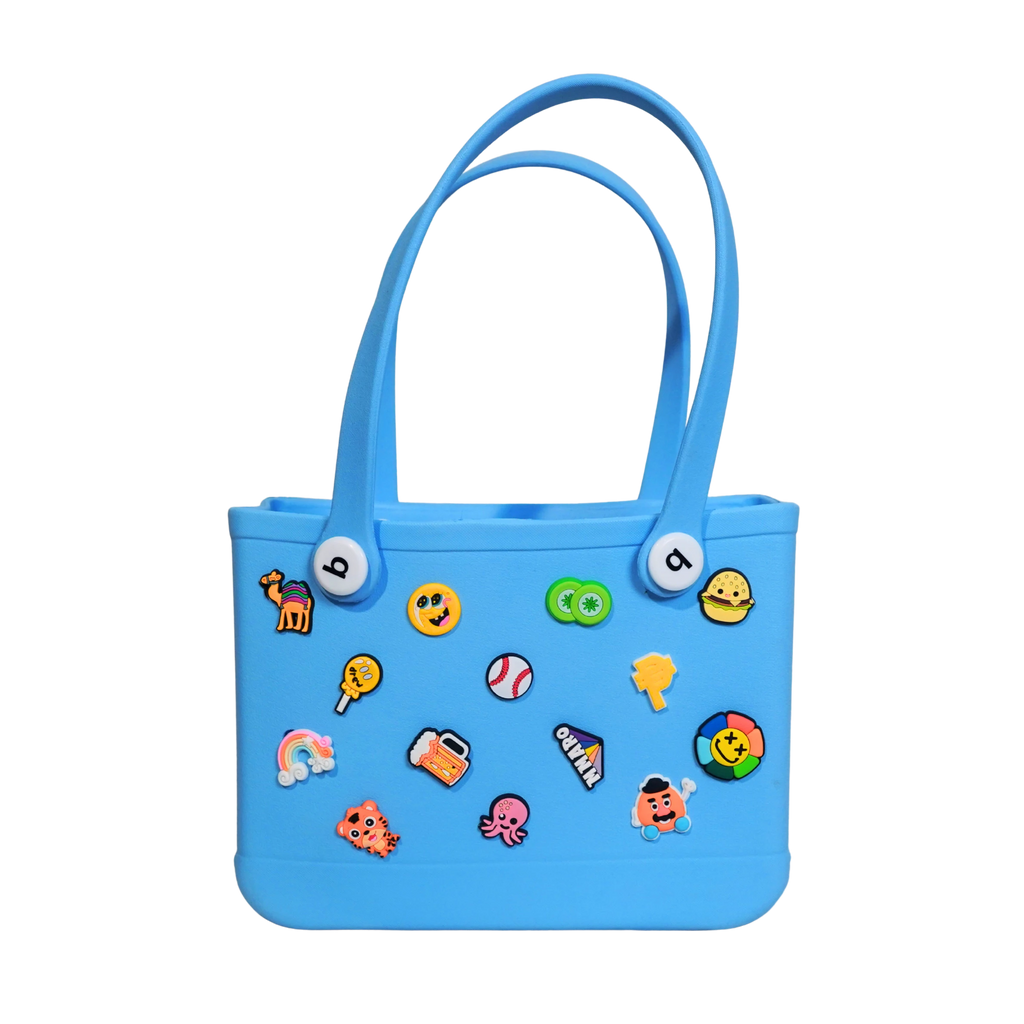 Mango Muffins blue waterproof PVC tote bag with fun colorful charms like a rainbow, octopus, and burger.