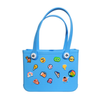 Mango Muffins blue waterproof PVC tote bag with fun colorful charms like a rainbow, octopus, and burger.