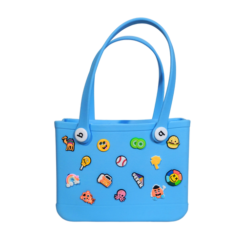 Mango Muffins blue waterproof PVC tote bag with fun colorful charms like a rainbow, octopus, and burger.