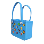 Mango Muffins blue waterproof PVC tote bag with fun Jibbitz-style charms and soft handles for kids.