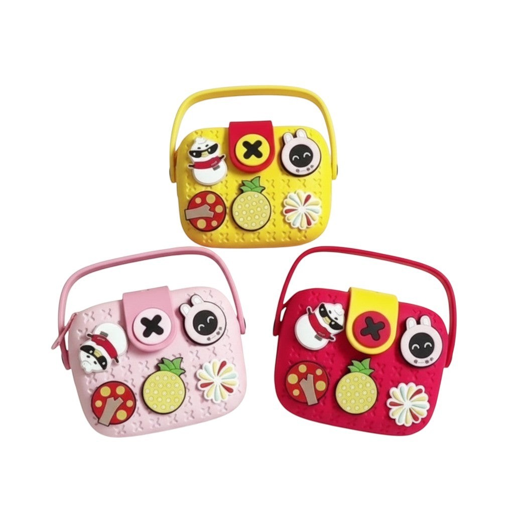 Mango Muffins Signature Series Charmer Sling crossbody bag in yellow, pink, and red EVA with customizable charms.