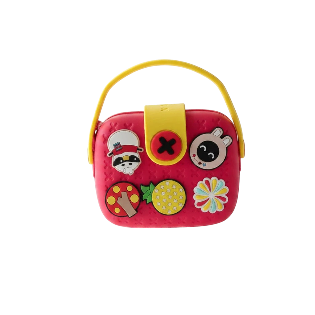 Mango Muffins Signature Series Charmer Sling crossbody bag for kids, red EVA with yellow snap closure and fun charms.