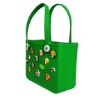 Mango Muffins bright green waterproof PVC tote bag with colorful Jibbitz-style charms and soft straps. Perfect for kids.