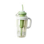 Mango Muffins Ice Cream Social Sipper tumbler with handle and straw, light green lid, white handle, clear yellow body.