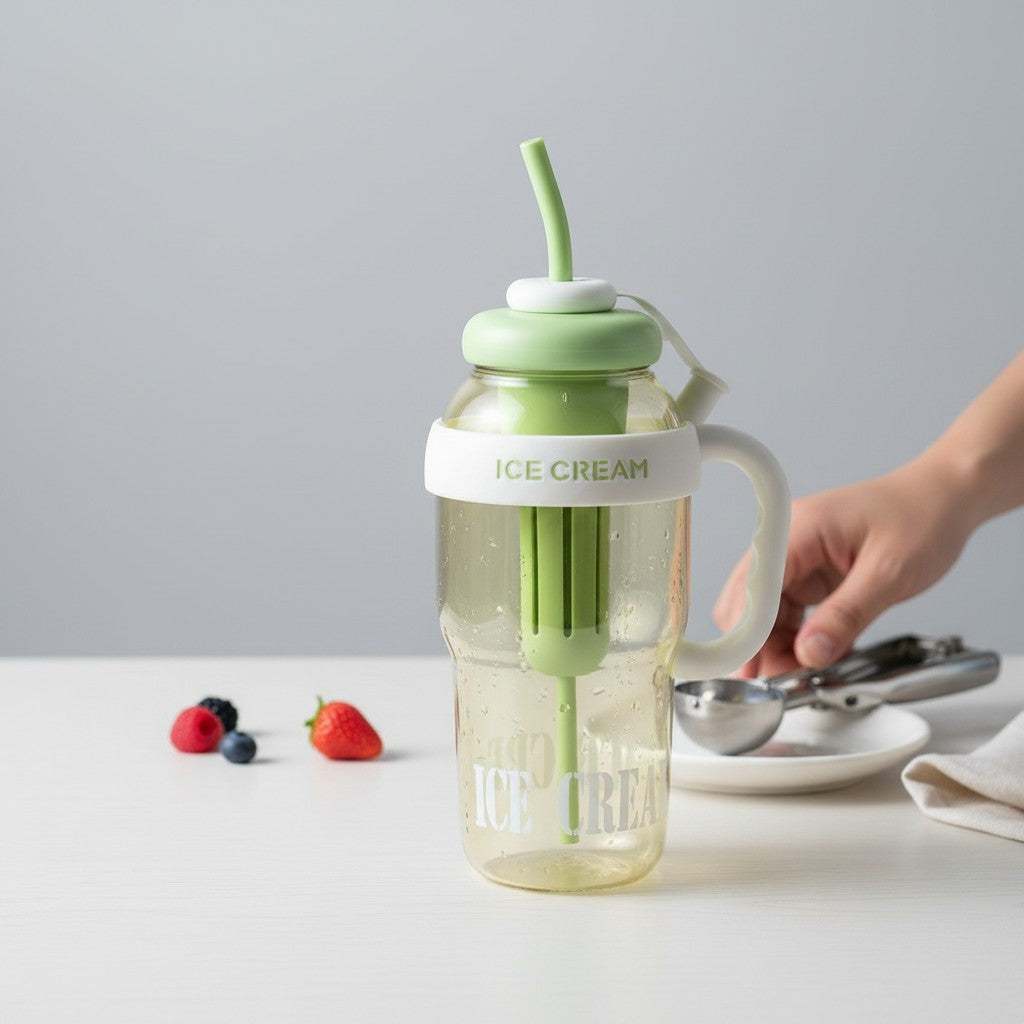 Mango Muffins Ice Cream Social Sipper tumbler with handle and straw, green lid, white accents, clear yellow body.