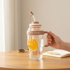 Mango Muffins Ice Cream Social Sipper tumbler with handle, straw, and orange slices. Features waffle texture and pastel band.