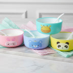 Mango Muffins set of 4 colorful kids' snack bowls featuring a bunny, bear, giraffe, and panda design. Each bowl has a spoon.
