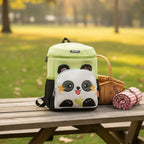 Mango Muffins light green backpack with a cute white panda face pocket, floppy ears, and embroidered details.