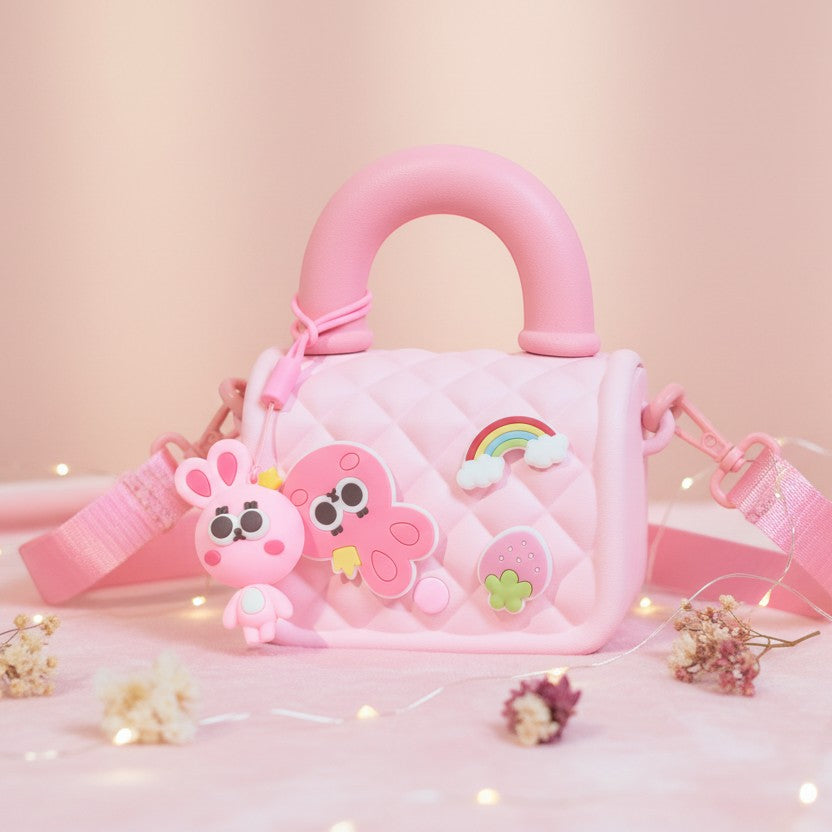 Mango Muffins pink quilted mini sling bag with cute bunny and octopus charms, rainbow and strawberry appliques.