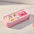 Mango Muffins pink pencil case with cute 3D bear, strawberry, carrot, banana, and flower charms. Zipper closure.