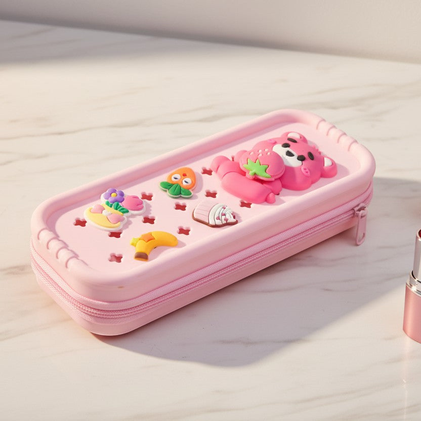Mango Muffins pink pencil case with cute 3D bear, strawberry, carrot, banana, and flower charms. Zipper closure.