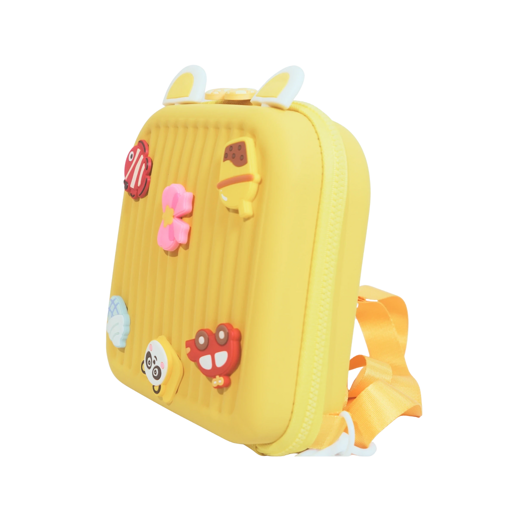 Mango Muffins yellow hard shell backpack with cute 3D charms like a panda, ice cream, and fish.