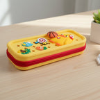 Mango Muffins yellow pencil case with red zipper, featuring a giraffe design and playful charms like a basketball and lollipop.