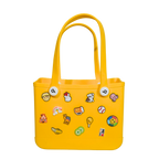 Mango Muffins yellow waterproof PVC tote bag with playful charms and soft straps, perfect for kids.