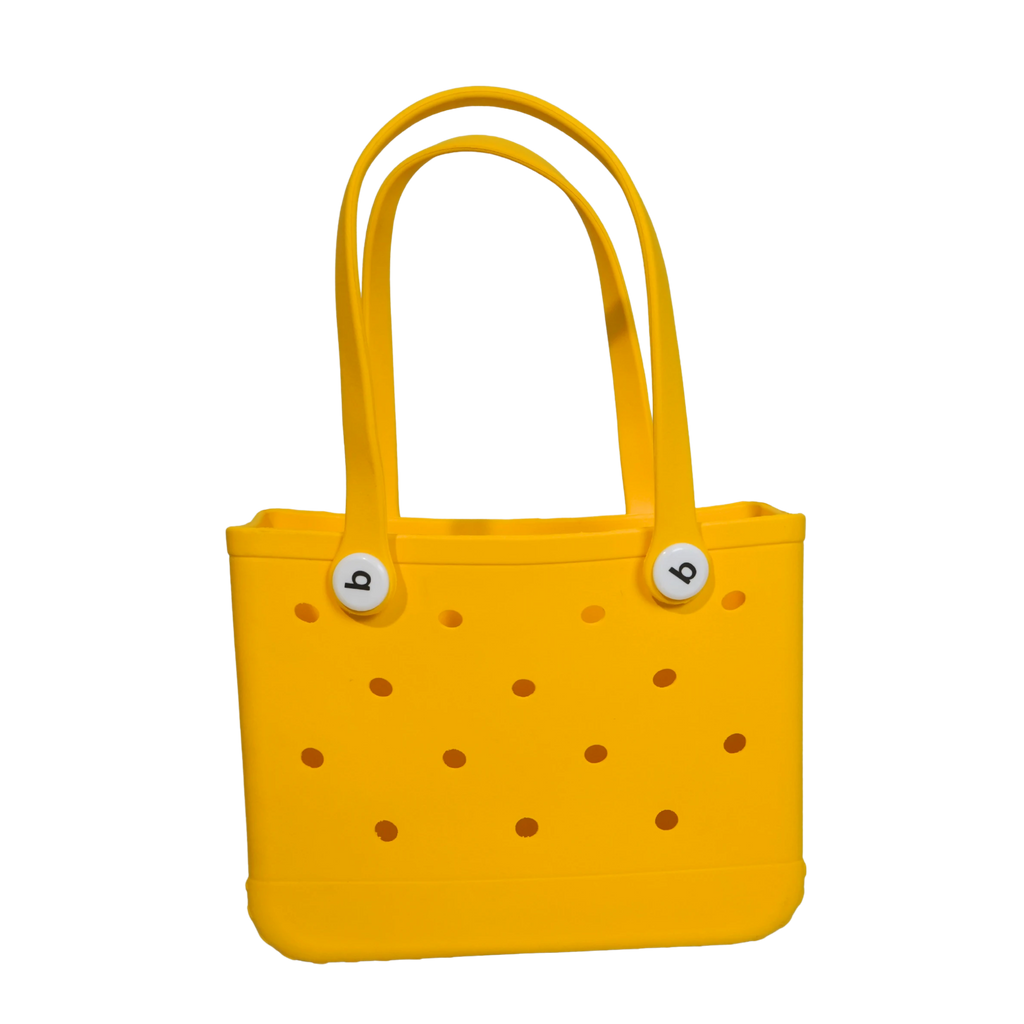 Mango Muffins yellow waterproof PVC tote bag with holes and white button accents, perfect for beach or pool.